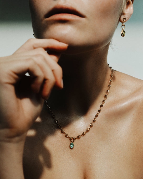 <p>frond charm drop earrings</p><span>antique peridots</span><span>circa 1940</span>