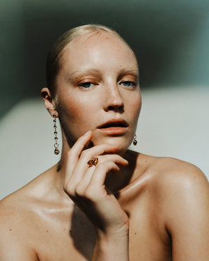 <p>frond crossover ring</p><span>antique sapphire + topaz</span><span>circa 1940 + 1950</span>