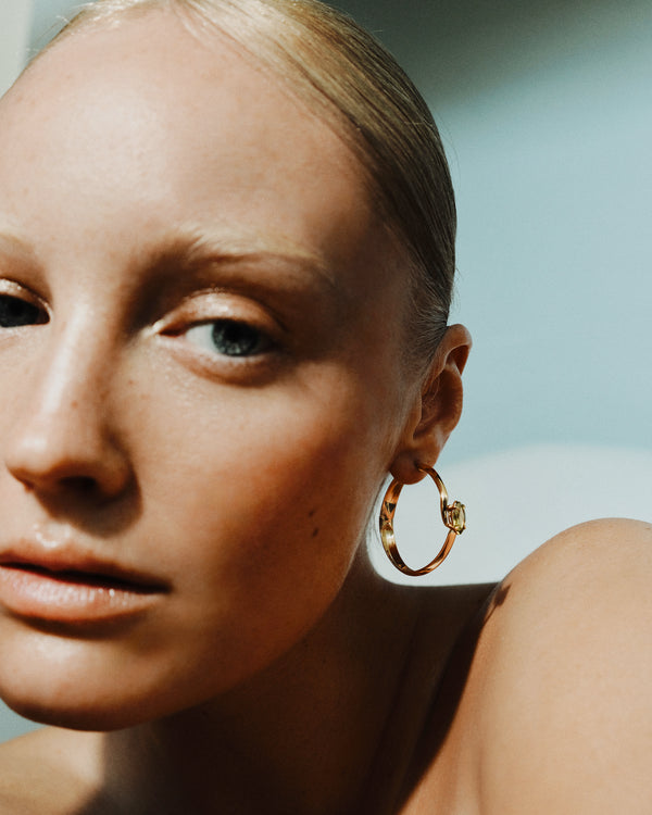 <p>frond spiral hoop earrings - 1.25</p><span>vintage peridots</span><span>circa 1970</span>