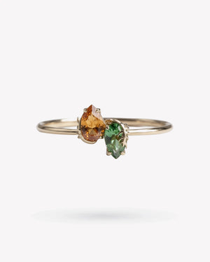 <p>frond crossover cuff bracelet</p><span>antique topaz + emerald</span><span>circa 1920 + 1930</span>