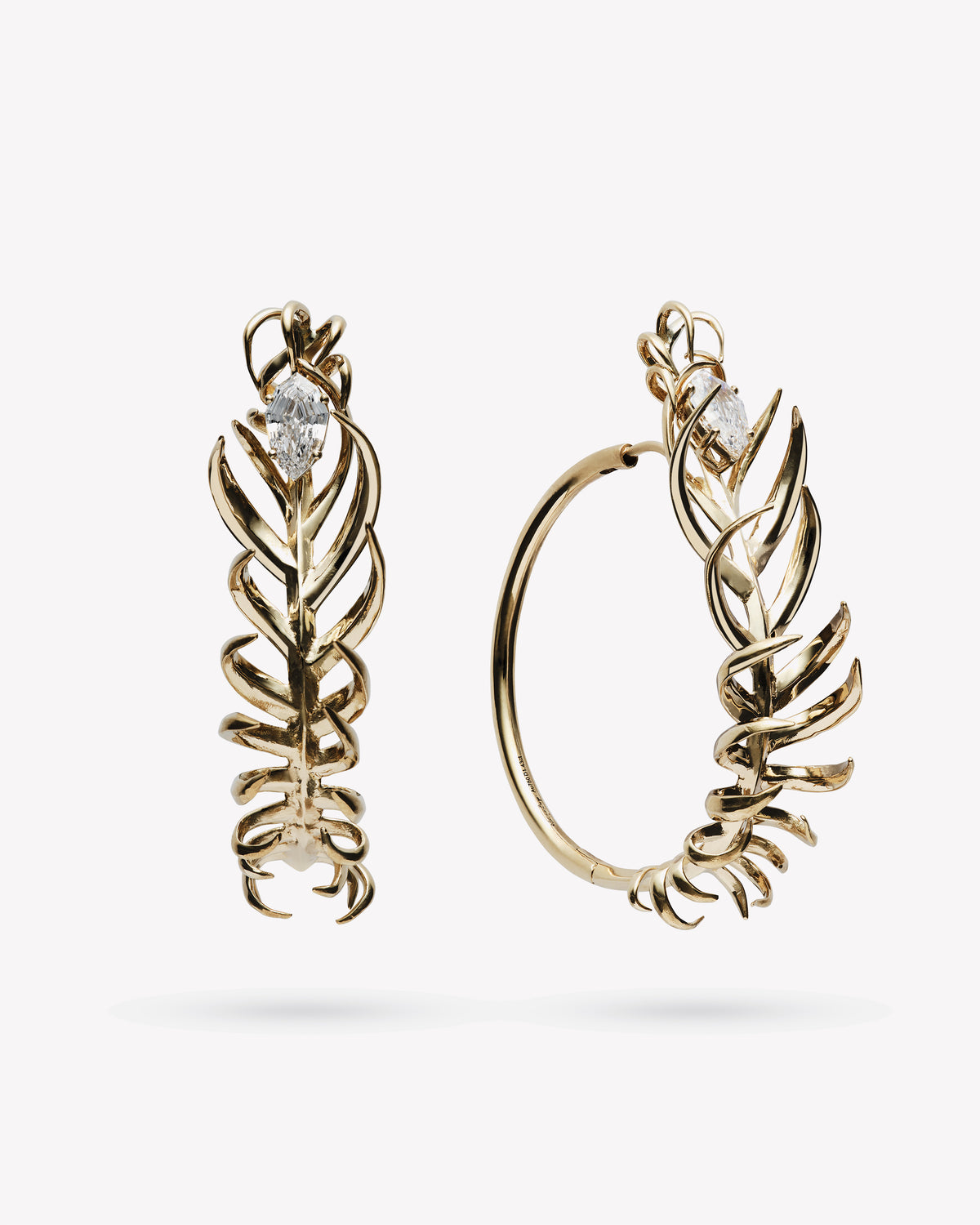 <p>frond hoop earrings - 1.5"</p><span>antique diamonds</span><span>circa 1920</span>
